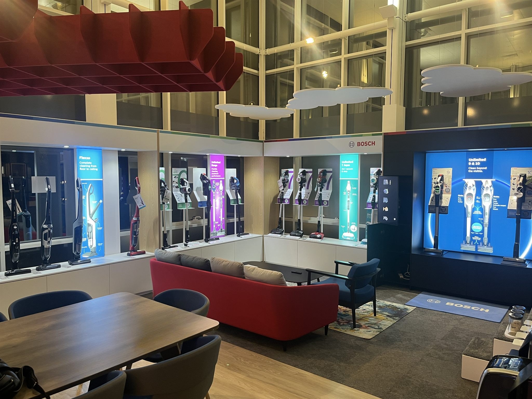 Bosch floorcare showcase display at BSH HQ with cordless vacuum range and illuminated branding